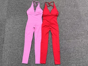 Detail of cross-tie back yoga jumpsuit with moisture-wicking fabric and scrunch butt effect