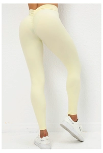 Λεπτομέρεια του κολάν high waist scrunch butt σε απαλό κίτρινο με περίγραμμα χωρίς ραφές
