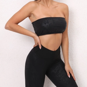 Close-up of black strapless yoga bra with textured snakeskin pattern for fitness