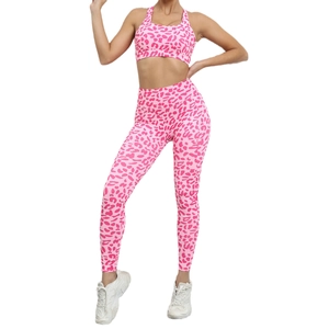 Pink leopard print yoga set with cross-back sports bra and high-waisted leggings