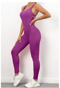 Detail view of purple ruched lifting jumpsuit with racerback and open back design