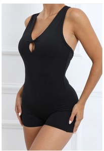 Close-up of black yoga bodysuit with front cutout and racerback design for fitness