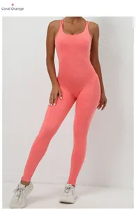 Detail of coral orange scrunch butt yoga bodysuit with textured moisture-wicking fabric