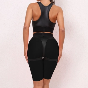 Detail of the racerback sports bra and high-waist fitness shorts with ergonomic contouring