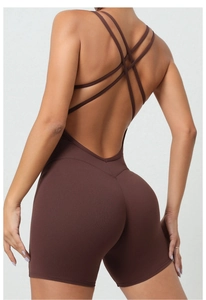 Detailed back view of brown yoga jumpsuit with thin criss-cross straps and open back