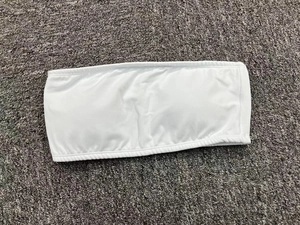 Flat lay of a white strapless tube top sports bra made from elastic knit fabric