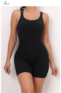 Close-up of black one-piece yoga jumpsuit with slim straps and body-sculpting fabric