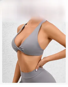 Detail of grey yoga set featuring low-cut V-neck design and snug fit sports bra