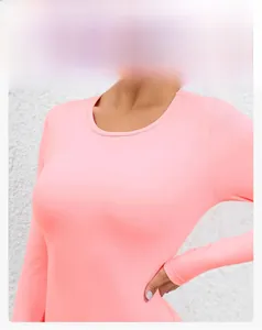 Detail of light pink long sleeve yoga jumpsuit with a comfortable round neckline