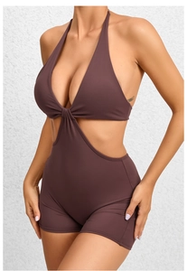 Detail view of coffee brown halter neck yoga jumpsuit with side waist cut-out design