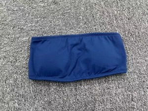Detail view of seamless dark blue strapless yoga sports bra with reinforced stitching
