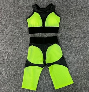 Close-up of black and neon green mesh panels on a two-piece women's yoga set