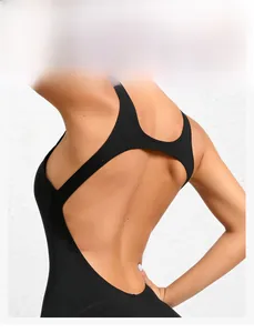 Detail of black one-piece yoga bodysuit showing hollow-out back design and elastic fabric