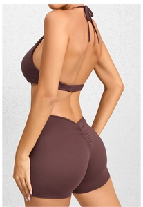 Detail view of coffee brown backless halter top and ruched high waist butt lifting shorts