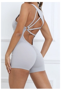 Detail of light grey ruched back yoga jumpsuit with elegant criss-cross straps