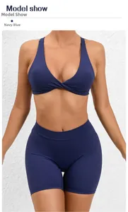 Detail of navy blue yoga set showing the twist-front sports bra and high-waisted gym shorts