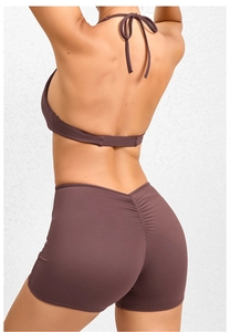 Detail of high-waist V-cut yoga shorts with ruched back design for a lifting effect