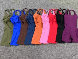 Cross back strapless athletic romper jumpsuit shown in nine vibrant available colors