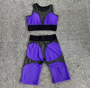 Detail of two-piece sports set with purple mesh and black faux leather panels