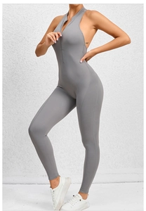 Close-up of a grey yoga jumpsuit with front zipper and open back design for fitness