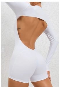 Detailed back view of a white backless long sleeve yoga bodysuit with premium stitching