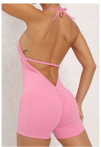 Close-up of pink backless yoga jumpsuit featuring scrunch butt detail and high elastic fabric