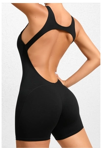 Macro view of the open-back and T-back design on this black athletic yoga jumpsuit