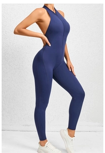 Detail view of the side profile showing a deep blue yoga bodysuit with front zipper design
