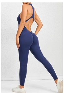 Detail of navy blue yoga bodysuit featuring back cross straps and scrunch butt design