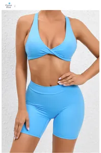 Detail view of flame blue yoga set with twist-front sports bra and high waist shorts