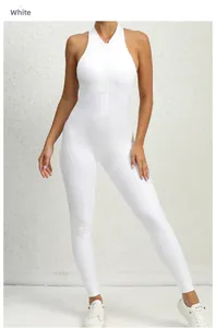 Detailed close-up of a white one-piece yoga jumpsuit with front zipper and sleeveless design