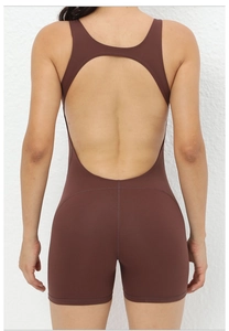 Close-up of women's dark brown yoga jumpsuit featuring a teardrop open back design