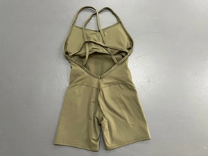 Tuta da yoga verde oliva senza schiena con spalline incrociate e tessuto elastico