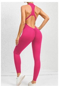 Hot pink yoga jumpsuit with open back cutout and scrunch butt lifting detail