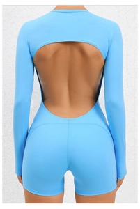 Macro detail of the backless cutout design on a light blue high-stretch yoga bodysuit