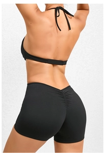 Rear view of black ruched yoga jumpsuit highlighting high-waist lifting effect