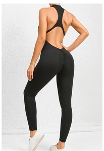 Close-up of ruched booty lifting detail and back cutout on black yoga bodysuit