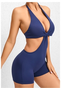 Detail of navy blue halter jumpsuit with side cutouts and ruched chest design
