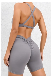 Detail view of high-waist grey yoga shorts with scrunch butt lifting design for women