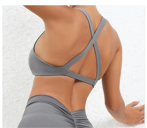 Close-up of dark grey yoga bra featuring high-stretch fabric and double criss-cross straps