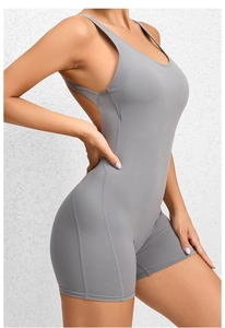 Detail view of seamless grey yoga romper with open back and supportive bodycon stitching