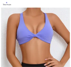 Detail of blue-violet cross-knot front sports bra with a sleek V-neck and moisture-wicking fabric