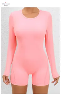 Detail view of wild peach high elastic compression yoga romper with long sleeves