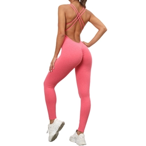 Pink scrunch butt yoga jumpsuit with cross back straps and moisture-wicking fabric