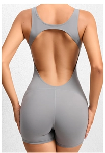 Close-up back view of grey backless yoga bodysuit with athletic cutout design