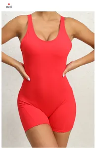 Front view of a vibrant red one-piece yoga bodysuit featuring high-stretch athletic fabric