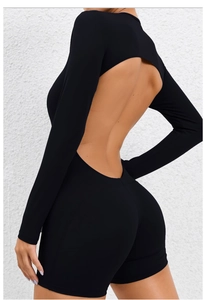 Close-up of black long sleeve backless yoga bodysuit highlighting the curved cutout design