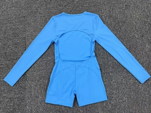 Detailed view of the back cutout and high-elastic fabric on sky blue yoga bodysuit