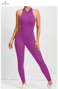 Detail of magenta yoga jumpsuit featuring a front zipper and sleeveless halter neck design