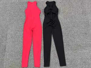Flat lay of yoga jumpsuits with front zipper and open back detail in rose and black